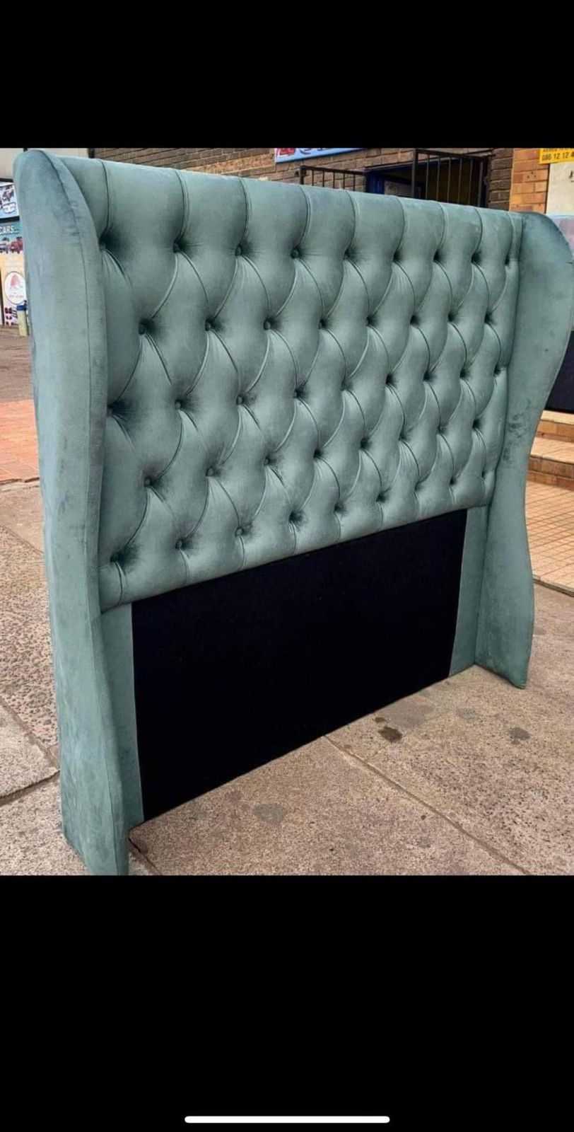 Curvy wings chesterfield headboard